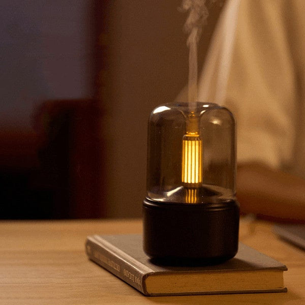 جهاز موزّع للروائح العطرية مع ضوء الشموع الخافت