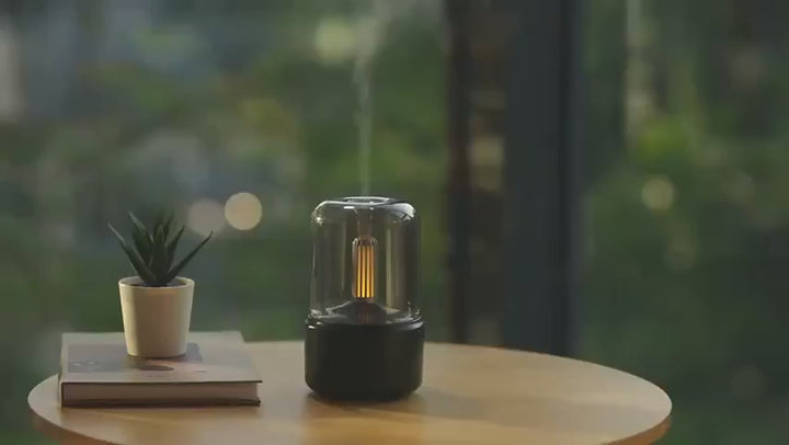 Aromatherapy diffuser with dim candle light